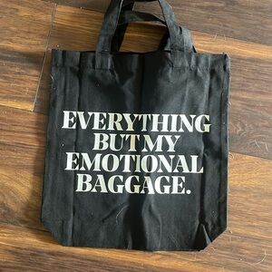 Everything but my emotional baggage black canvas tote bag